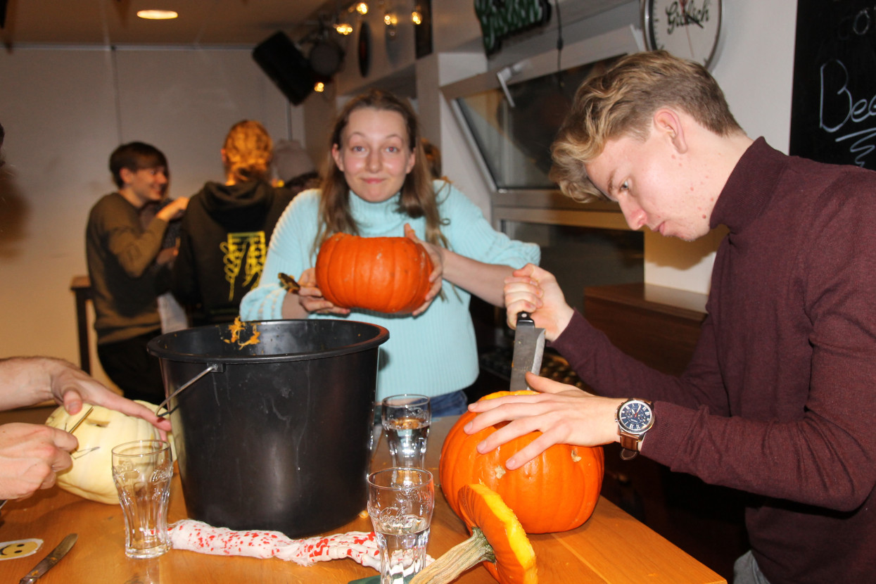 Pumpkin carving and Halloween drink