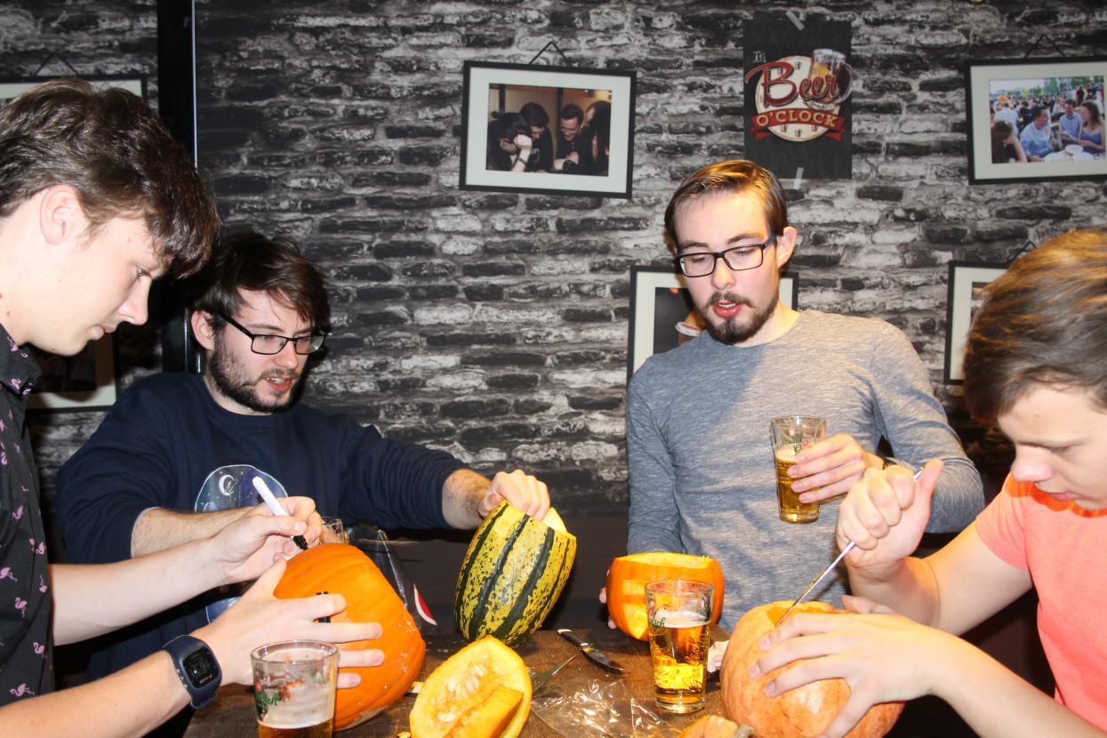 Pumpkin carving and Halloween drink