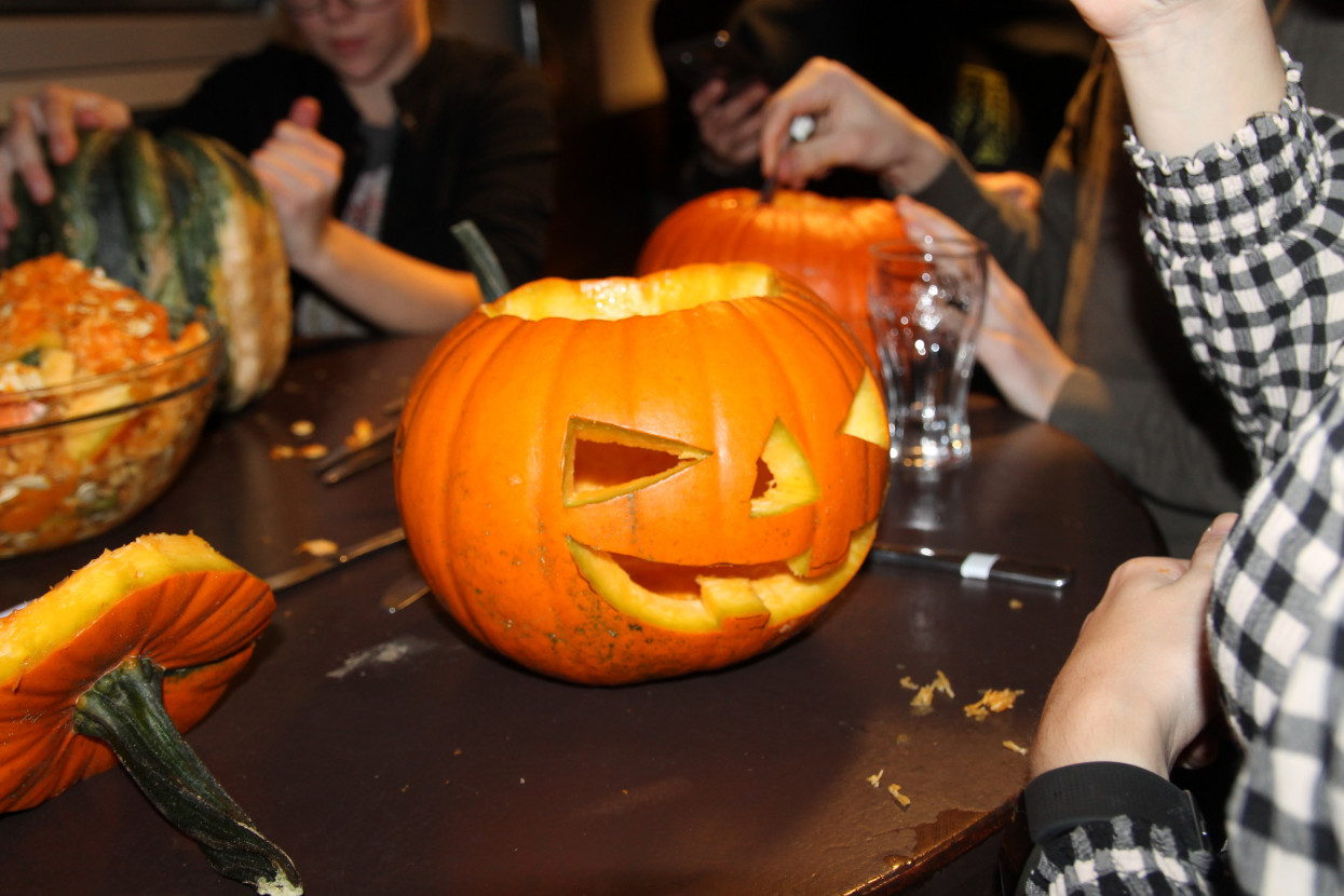 Pumpkin carving and Halloween drink