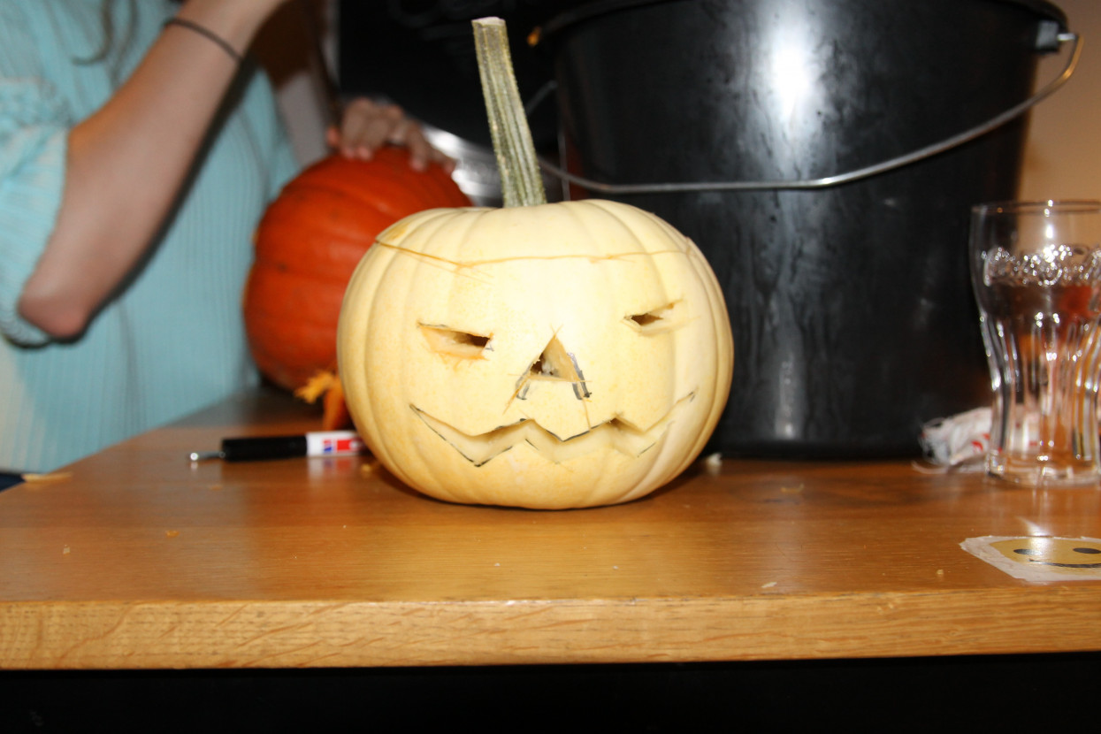 Pumpkin carving and Halloween drink