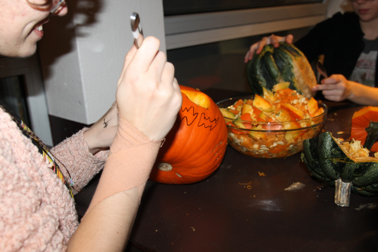 Pumpkin carving and Halloween drink