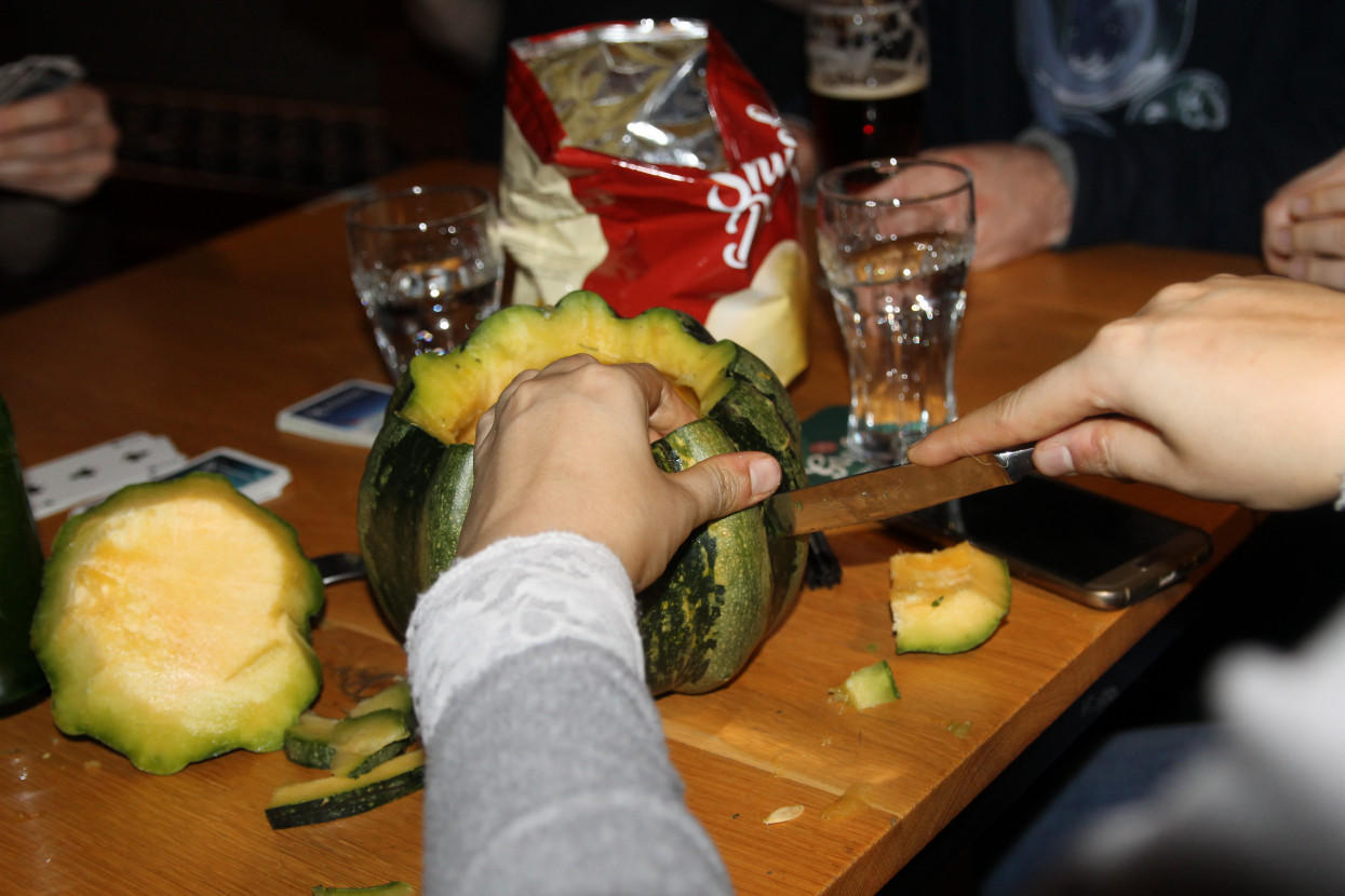 Pumpkin carving and Halloween drink